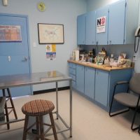 Exam table and equipment in exam room