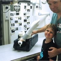 Doctor and little boy taking care of a stuffed dog