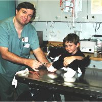 Doctor and little boy taking a